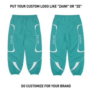 Pantalon coupe-vent réversible léger en taffetas de coton premium 110 GSM, turquoise avec panneau blanc, logo personnalisé imprimé, style jogger - Product Image 1