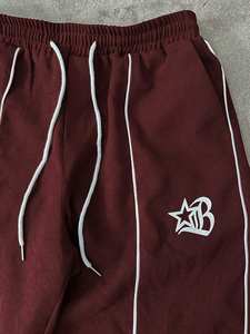 Ensemble veste légère et respirante à cordon de serrage avec finitions colorées et pantalon de sport ample et droit pour homme en polyester/nylon réfléchissant - Product Image 5