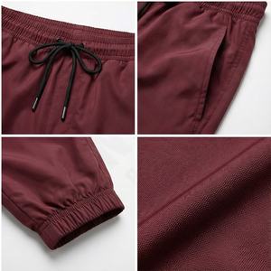 Pantalones impermeables de nailon con estampado de logotipo personalizado Popular de primavera, pantalones cortavientos de alta calidad para hombre, pantalones para correr con forro de malla - Product Image 4