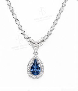 Elegant pendant <b>necklace</b> in 18K white gold with pear cut blue sapphire centerpiece classic halo of sparkling lab grown diamonds - Product Image 2