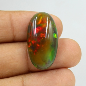 โอปอลเอธิโอเปียสีดำธรรมชาติ 22.00 กะรัต แบบคาโบชอง หลายสี ไฟหลากสี ผิวเรียบ ไม่มีตัวเรือน ใช้เป็นพลอยประจำเดือนตุลาคม ขนาด: 29X16X9 มม. - Product Image 1