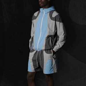 ชุดเซ็ตเสื้อแจ็คเก็ตกันลมสำหรับผู้ชายฤดูร้อน ชุดเซ็ตขาสั้นไนลอนสีตัดต่อสำหรับทุกเพศ - Product Image 1