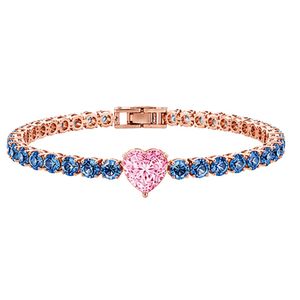 Exquisite tennis <b>bracelet</b> in 18K rose gold with vivid royal blue diamonds and pink heart center stone precision set brilliance - Product Image 1
