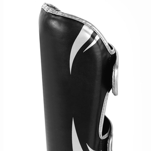 Protège-tibias en cuir PU noir avec fermeture auto-agrippante pour la protection sportive des adultes, design léger - Product Image 4