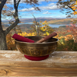 Brass singing bowl with polished golden rim and engraved Dharma wheel symbol on the exterior, available at wholesale prices. - Product Image 2