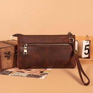 Pochette et porte-clés en cuir de luxe de haute qualité, conçus pour les réunions d'affaires et les déplacements, à prix abordable. - Product Image 1