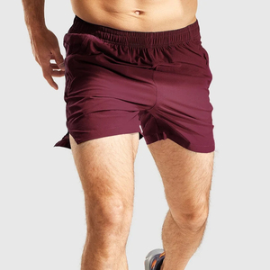 Shorts de sport pour homme, couleur bordeaux, séchage rapide, avec poches, taille élastique, longueur courte, couleur unie, tissu tricoté - Product Image 2