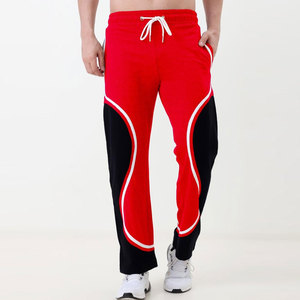 Pantalon de jogging décontracté rouge et noir à blocs de couleur, taille élastique avec cordon de serrage, poches latérales, respirant, poids moyen, idéal pour le printemps - Product Image 1
