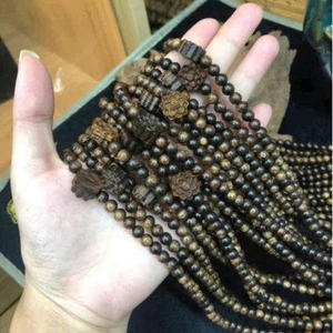 กำไลข้อมือไม้กฤษณาเวียดนามคุณภาพสูง ลูกปัดไม้ธรรมชาติ วินเทจ สำหรับวันครบรอบ หรือใช้เป็นลูกประคำ ขายส่ง รับผลิตแบบ OEM - Product Image 1