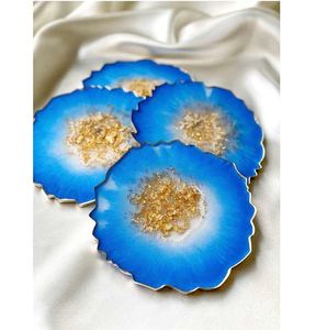 ชุดจานรองแก้วเรซิ่นสีน้ำเงินและสีขาว ดีไซน์กลิตเตอร์ทำมือ ผิวเรียบเนียน สวยงาม เหมาะสำหรับโต๊ะอาหาร - Product Image 1