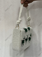 Pochette d'épaule artisanale perlée ivoire avec broderie palmier et motifs, fermeture éclair, bandoulière unique, sac de villégiature OEM personnalisable