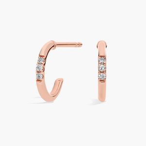 Petites boucles d'oreilles Huggie Mini-Hoop en diamant en or jaune 14 carats - Product Image 1