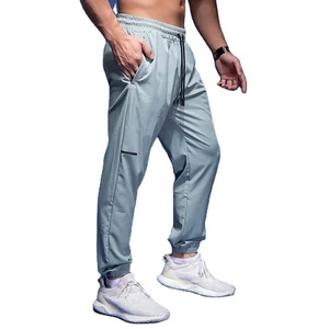 Pantalon de sport ajusté en polyester à maille performance œil-de-perdrix, coupe ajustée, avec fermeture à revers, pour la performance athlétique, Vente B2B - Product Image 1