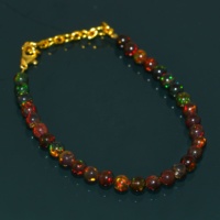Bracelet en pierre naturelle d'opale éthiopienne perles rondes unies noires plaquées or de haute qualité pour cadeau ou mariage