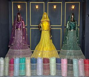 Tenue de mariage en lehenga choli en tissu filet avec broderie au fil, travail de miroir et décoration de pierres, disponible en 20 couleurs et 10 modèles - Product Image 1