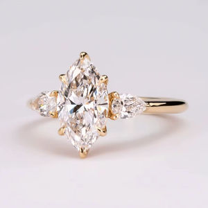 แหวนหมั้นเพชรทรงมาร์คีส์หรูหรา 1.50 กะรัต ทอง 18K/14K/10K แหวนเจ้าสาวสามเม็ด แหวนเพชรแบบกำหนดน้ำหนักได้ เครื่องประดับคุณภาพสูง ขายส่ง - Product Image 1