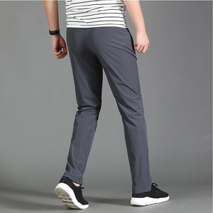 Pantalon de sport gris pour homme, taille élastique, séchage rapide, avec poches latérales, coupe décontractée légère, idéal pour le printemps - Product Image 2