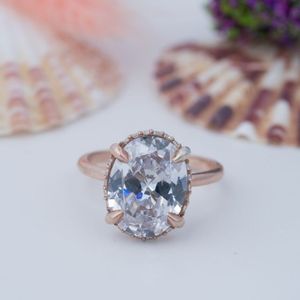 Vente en gros d'alliances de mariage en argent sterling 925 avec moissanite taille ovale, plaquées or rose et or 14 carats - Product Image 1