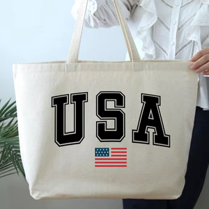 กระเป๋าผ้าแคนวาสขนาดใหญ่ลายธงชาติอเมริกัน กระเป๋าสะพายไหล่สำหรับใส่ของช้อปปิ้ง ใช้ซ้ำได้ เหมาะสำหรับซื้อของประจำวัน กระเป๋าถือสำหรับซูเปอร์มาร์เก็ตและห้างสรรพสินค้า - Product Image 1
