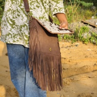 Cheveux sur le rabat en cuir véritable Style occidental nouveau sac à franges de créateur sac à bandoulière bohème femmes multi-usages sac à bandoulière