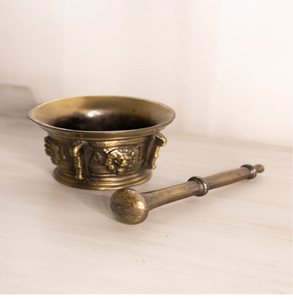 Antique European style shallow brass mortar pestle set with lion head side reliefs, available at wholesale prices. - Product Image 1