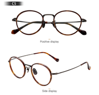Monture de lunettes en titane légère et ronde en gros avec plaquettes nasales réglables pour les acheteurs de détail d'optique