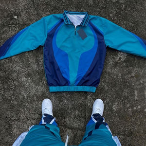 Conjunto Deportivo de Nylon para Hombre 2026 con Logotipo Personalizado, Chaqueta y Pantalones Cortavientos de Poliéster para Otoño - Product Image 1