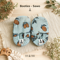 Botines acogedores hechos de tejido suave que brindan calidez, flexibilidad y comodidad con un elegante color sawo para las aventuras diarias.