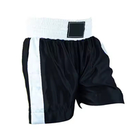 Shorts de boxe unisexe vert et noir à blocs de couleur, en polyester/coton, sur mesure, séchage rapide, extensibles, logo frontal, coupe ajustée, durables