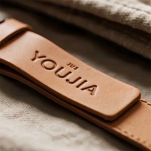 Sunny Feel PU Leather Embroidered Logo Patches Beige Adhesive Labels for Clothing Garments - Product Image 2