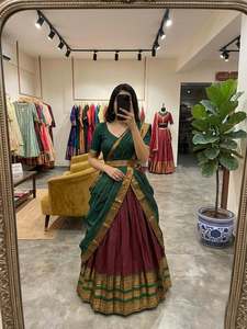 Conjunto de lehenga de algodón y seda exquisitamente elaborado con un llamativo contraste de tonos de joyas ricos y adornos dorados Zari. - Product Image 4