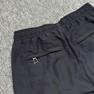 Pantalones cortavientos personalizados para hombre, de pierna ancha, con broches laterales, estilo hip hop, streetwear, holgados, de nailon, para entrenamiento. - Product Image 3