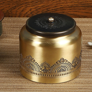 Charming antique brass ghee <b>pot</b> rests gracefully on a natural stone with a custom spoon. Available at wholesale price. - Product Image 2