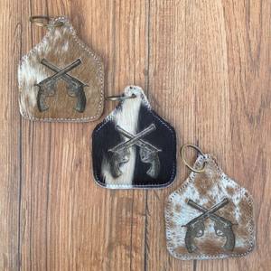 Nueva venta al por mayor de pelo personalizado en cuero de vaca grabado láser muñequera borla bolsa cuero de vaca grabado láser llavero Combo Set - Product Image 2