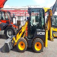 Chargeuse compacte sur chenilles JCB 1CX en bon état, type mobile, capacité nominale de 3 tonnes, mini-benne avant, moteur diesel, entraînement par pompe
