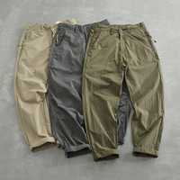 Celana Kasual Pria Model Tapered Fit Anti Air Cepat Kering Bahan Polyester dengan Saku Samping Pinggang Sedang Kancing Depan Ringan untuk Musim Panas