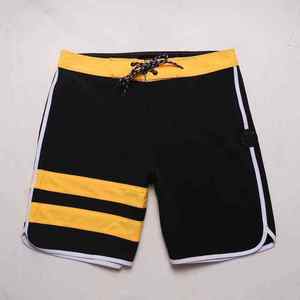 Short de bain décontracté pour homme, noir et jaune rayé, séchage rapide, taille à cordon de serrage - Product Image 1