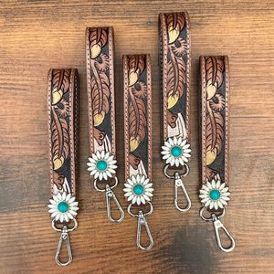 2025คล้องข้อมือหนังขนนกสำหรับผู้หญิงหนังแท้สายคล้องพวงกุญแจดีไซน์ขนนกทำจากหนังแท้ - Product Image 4