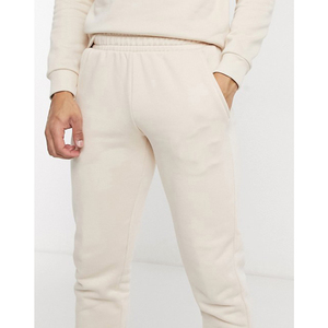 Pantalon de survêtement unisexe en coton crème avec poches latérales, taille élastique, coupe décontractée, idéal pour l'automne - Product Image 2