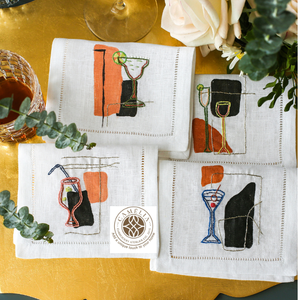 Serviette en lin blanc avec broderie abstraite sur le thème des cocktails, accents orange-noir audacieux ajoutant une touche artistique aux tables - Product Image 1