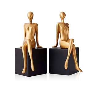 Modern design cast aluminum seated human figurine with wooden base bookend set black and gold decorative book holder - Product Image 1