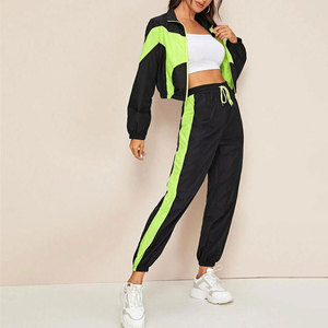 Ensemble de survêtement deux pièces respirant pour femme, coupe-vent, couleurs, tailles et logo personnalisables, motif uni, vente en gros - Product Image 1