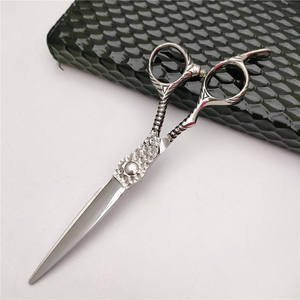 Juego de Tijeras de Peluquería Ovexa de Acero Inoxidable Quirúrgico, 10 mm de Longitud, Agarre Perfecto y Duradero, Herramientas para Cortar el Cabello con Bolsa - Product Image 1