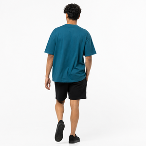 เสื้อยืดผู้ชายโอเวอร์ไซส์ผ้าฝ้ายเจอร์ซีย์สีพื้น แขนสั้น คอกลม ทรงลำลอง สีน้ำเงิน - Product Image 3