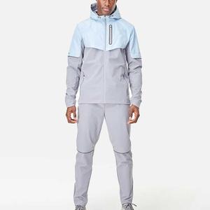 Conjunto Deportivo de 2 Piezas para Hombre, Chaqueta con Capucha y Pantalones Ajustados, Bloques de Color, Resistente al Viento, Repelente al Agua, Elástico en 4 Direcciones, para Correr y Entrenar - Product Image 1