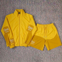Ensemble veste et pantalon coupe-vent de haute qualité pour hommes, idéal pour la course à pied, l'entraînement sportif et les activités de plein air, léger et personnalisable.