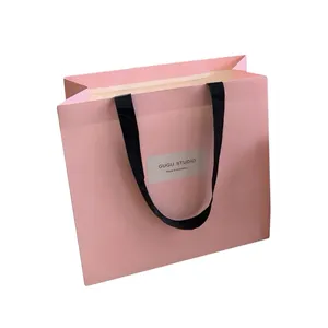Túi giấy tùy chỉnh di động có thể tái chế với bề mặt in để mua sắm và tặng quà cho hàng thủ công