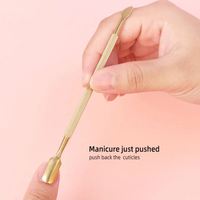 Outil professionnel de repousse-cuticules à double tête en acier inoxydable Prime Care, avec poignée confortable pour un traitement des ongles de haute qualité en salon