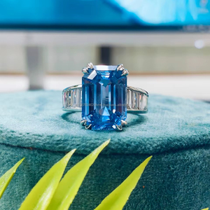 White Gold <b>Ring</b> featuring Emerald Blue Diamond with Sparkling Side Stones, <b>crafted</b> for a bold, elegant, and sophisticated look - Product Image 1