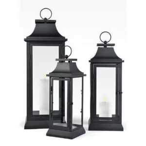 Modern black metal <b>lantern</b> <b>set</b> with glass panels pyramid top ring handle white candle indoor outdoor lighting accessory - Product Image 1